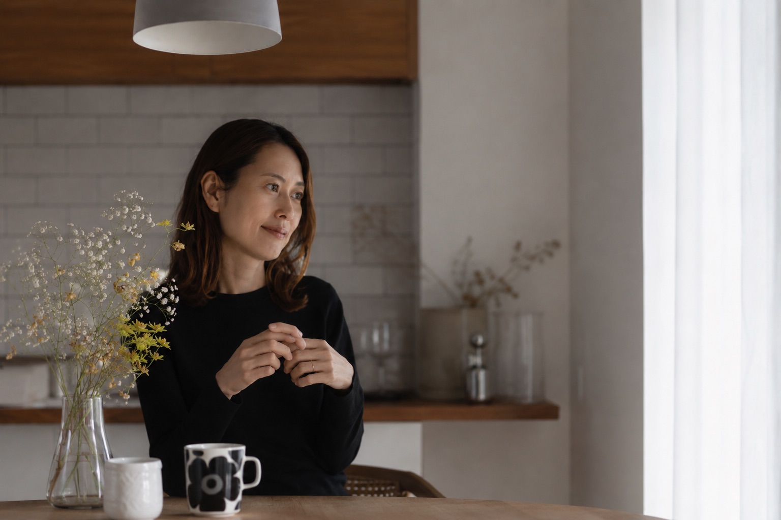 Risa — environmental portrait, kitchen studio.